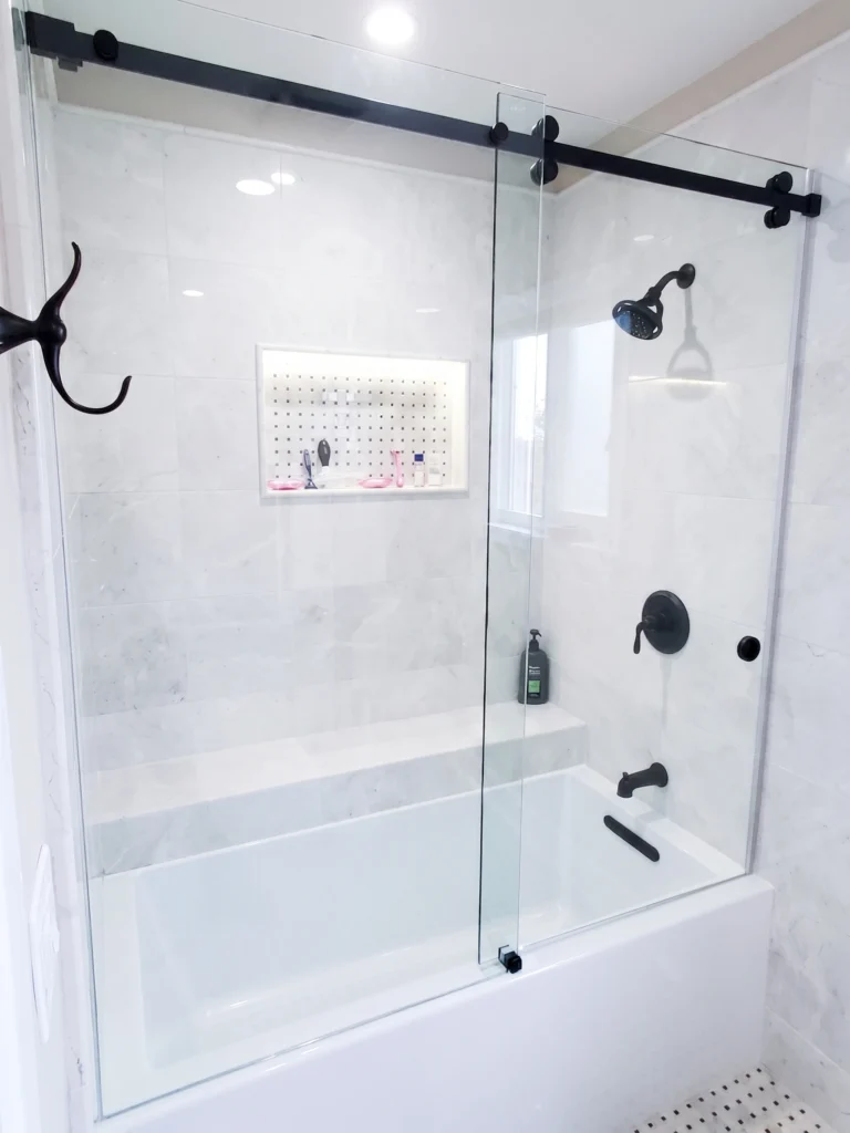 Modern tub glass sliding door in new bathroom